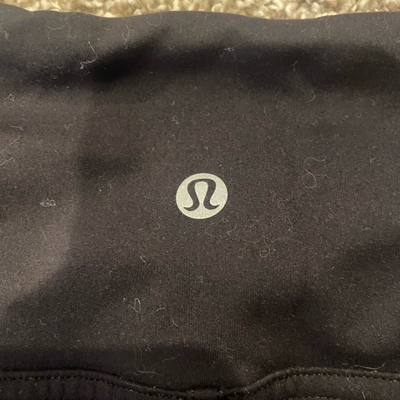 Cute high rise, full length Lululemon leggings with sections of pink pattern. - Picture 2 of 4